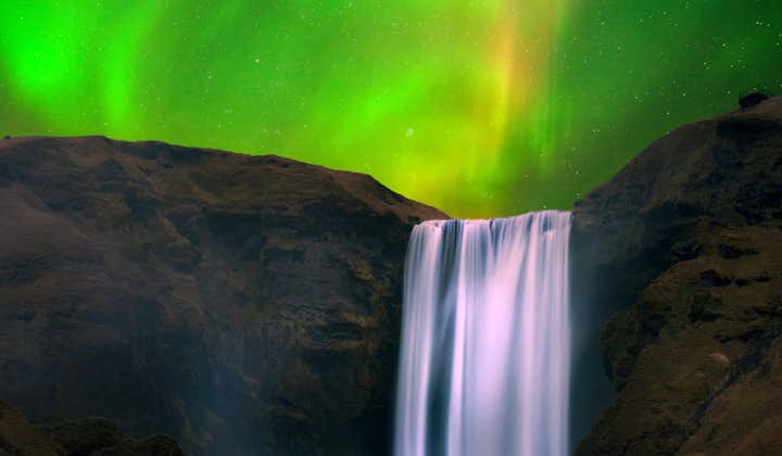 If you travel Iceland's South Coast during the winter, Skógafoss Waterfall might just be basked in the glory of the Northern Lights.