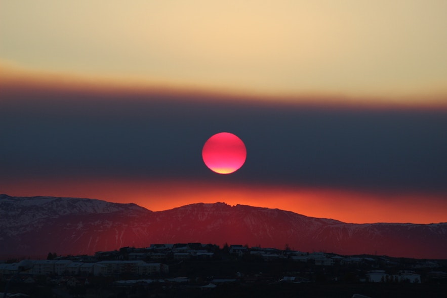 Blood red sun rising over ReykjavÃ­k, Ã“ttar Sveinsson
