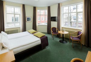  Een kamer in Center Hotels Skjaldbreid met een prachtig uitzicht op Reykjavik.