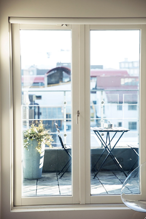 Some rooms at 101 Hotel Reykjavik have full-length windows and a balcony for relaxation.