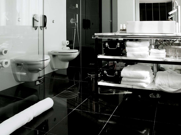 An elegant and stylish bathroom with quality towels at 101 Hotel Reykjavik.