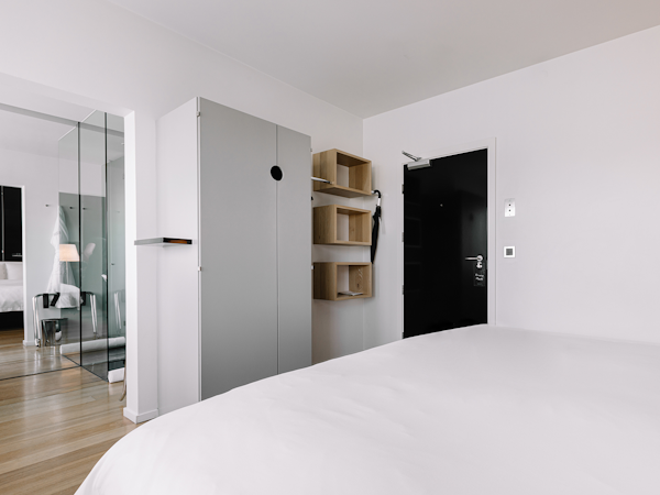 A room with a closet and shelving at 101 Hotel Reykjavik.