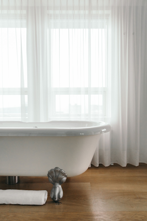 Enjoy a hot soak in your in-room bathtub at 101 Hotel Reykjavik.