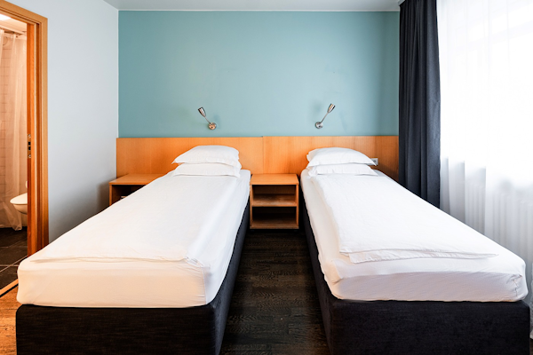 Two single beds in a twin room at Center Hotels Klopp, Reykjavik.