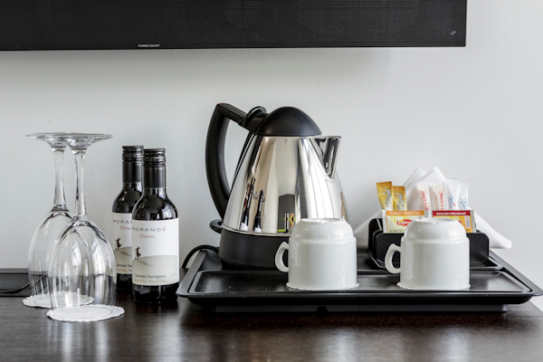 Small bottles of wine and tea and coffee amenities at Center Hotels Arnarhvoll.
