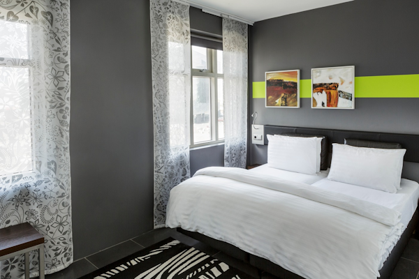 The stylish and elegant rooms at Center Hotels Arnarhvoll are adorned with tasteful artwork.