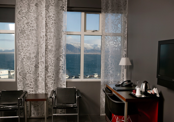 A room at Center Hotels Arnarhvoll has a comfortable place to sit and enjoy the stunning views across Faxafloi bay.