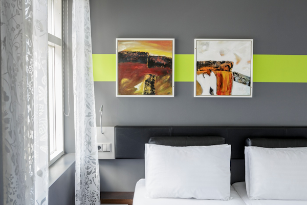 Bright artwork adorns a room at Center Hotels Arnarhvoll.