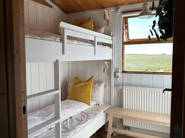 Two bunk beds in one of the bedrooms at Hestaland Horse Farm Cottage.
