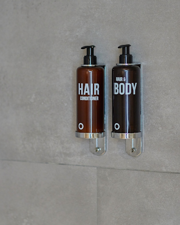 Hair and body wash and hair conditioner in the bathroom at the Center Hotels Plaza in Reykjavik.