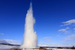 Take a photo of an erupting geyser in the Geysir geothermal area.