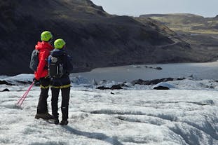Glacier hikers enjoying the surrounding views of Solheimajokull in Iceland.