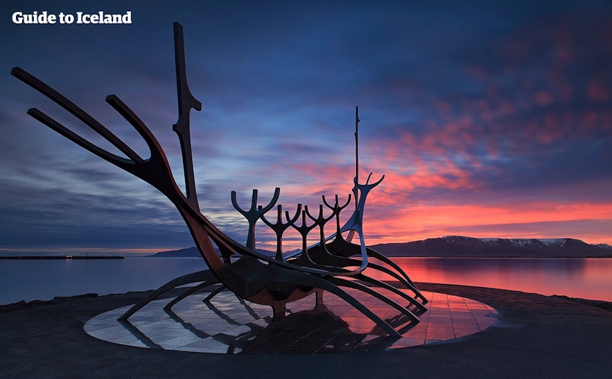 The Sun Voyager in Central Reykjaví­k and Mount Esja across the bay.