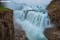 Снимок водопада Гюдльфосс на длинной выдержке в пасмурный день.