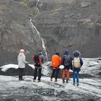 A group on an ice-hiking tour on the Solheimajokull glacier.