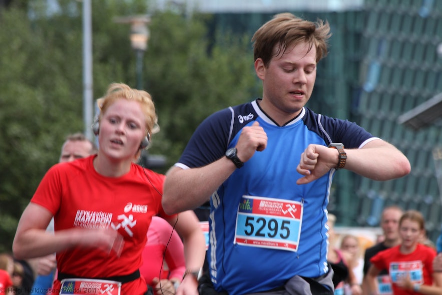 Contestants in the Reykjavik Marathon pass through downtown Reykjavik