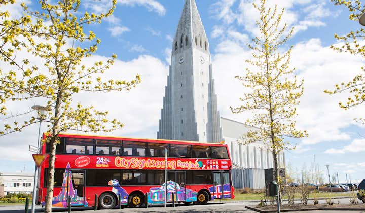 The City Sightseeing Bus as it passes by the Lutheran Church, and cultural landmark, Hallgrímskirkja.