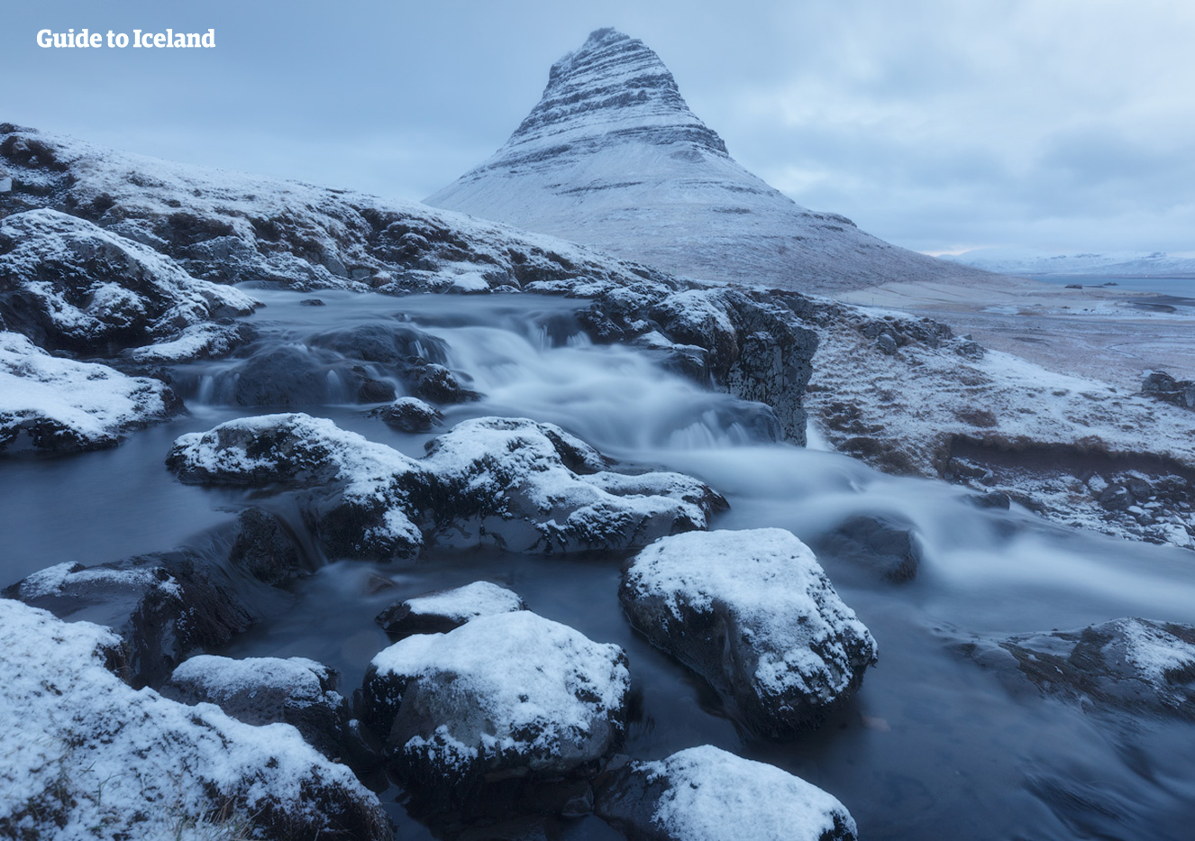 Mt. Kirkjufell, standing by the Snæfellsnes peninsula, takes on a striking look covered with snow during the Icelandic winter.