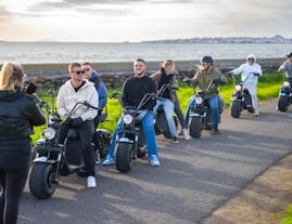 A group of people on an e-scooter sightseeing tour in Reykjavik.