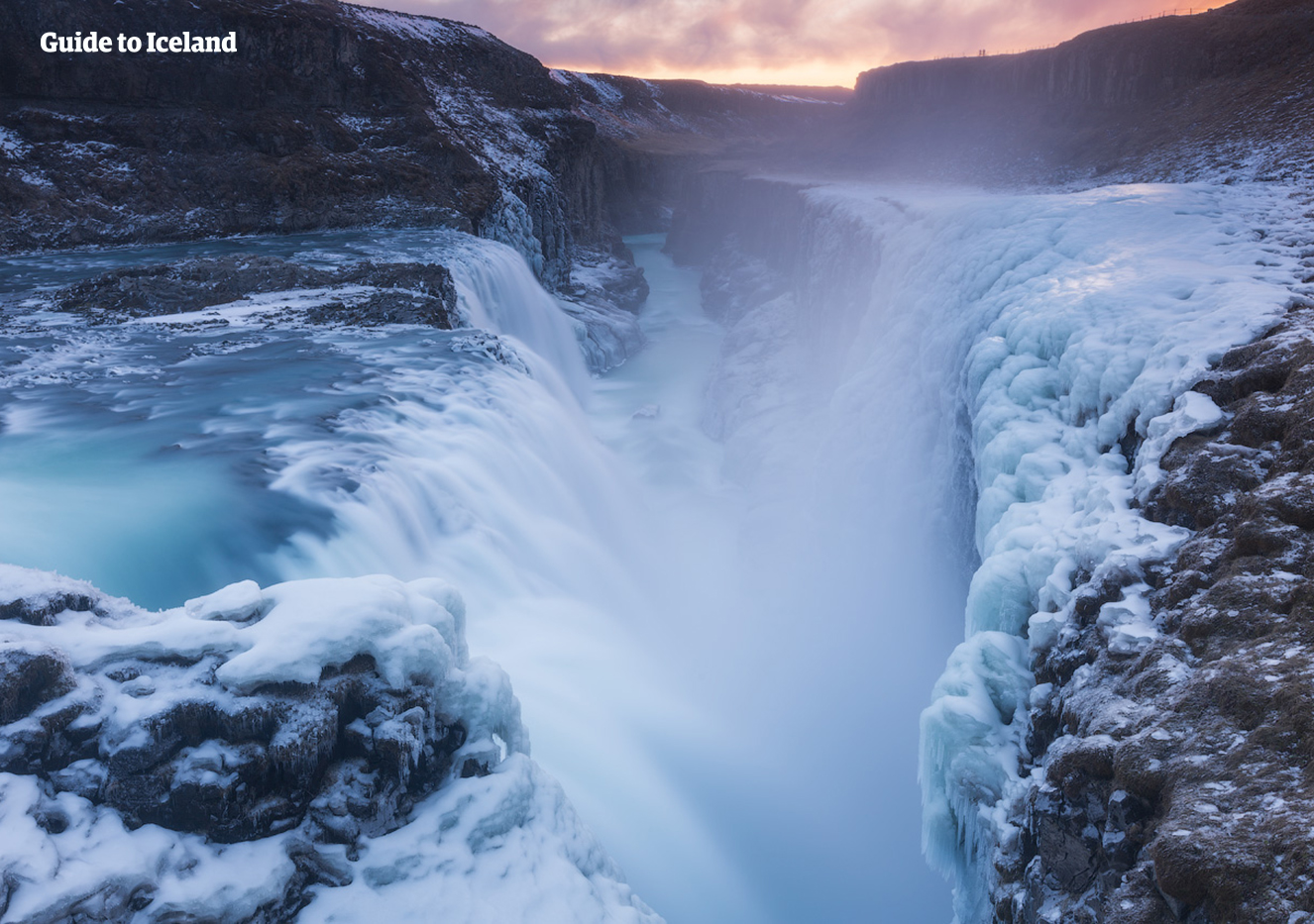 Gullfoss waterfall in winter becomes surrounded in ice and snow, yet the Hvíta river continues to forcefully flow.