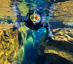 Snorkeling Tour Between Continents in Silfra with Free Underwater Photos & Snacks