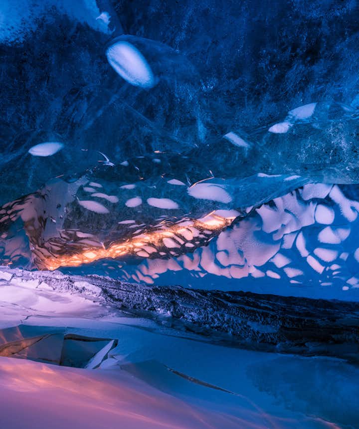 Stepping into one of Iceland's ice caves is like stepping into another dimension entirely.