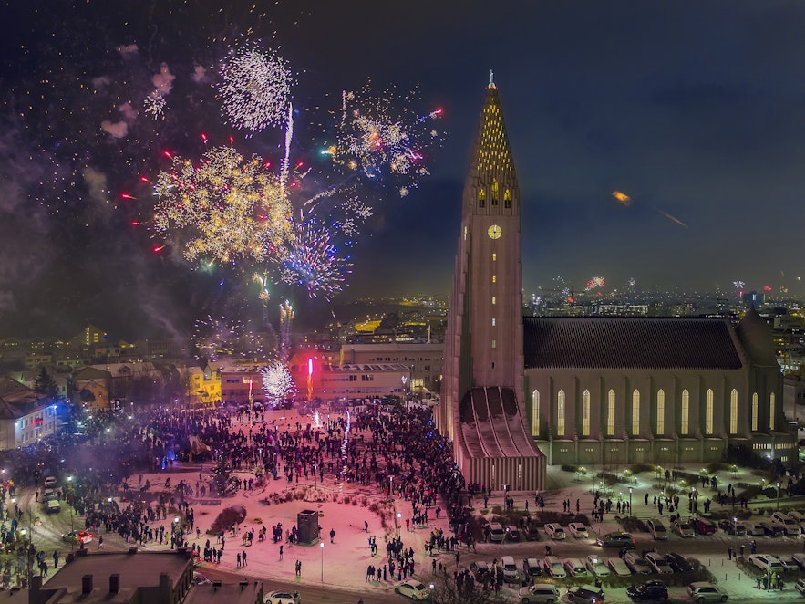 Bird's-eye-view of New Year's fireworks celebrations in the public square in front of Hallgrimskirkja