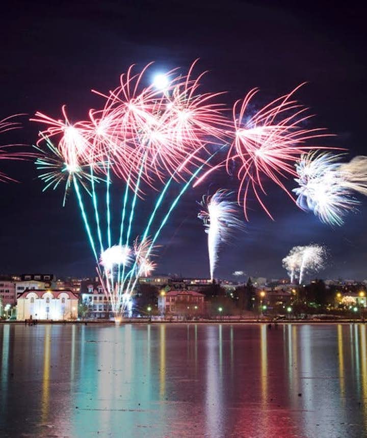 Views of Reykjavík's fireworks on New Year's Eve from Tjörnin