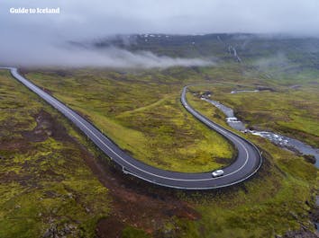 Driving the twisting mountain road of Seyðisfjörður in the East Fjords of Iceland.
