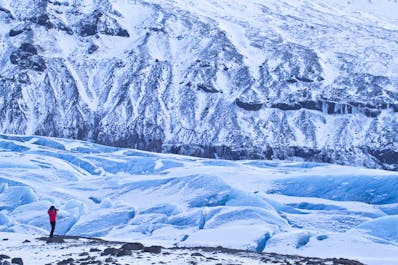 Go glacier hiking on Svinafellsjökull glacier and pass deep crevasses and blue ice sculptures.