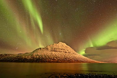 Watch the Northern Lights dance in the evening sky on your 10-day adventure tour.