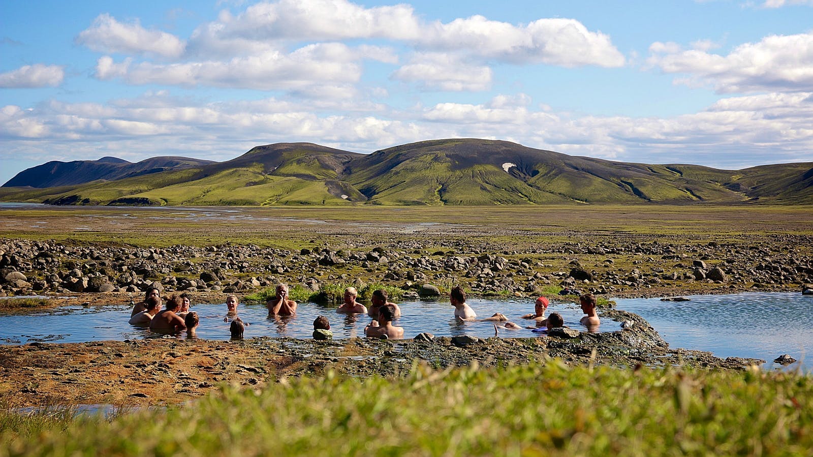 Bathing in the natural hot spring of Strútslaug in the Highlands of Iceland is a popular activity for passing hikers.