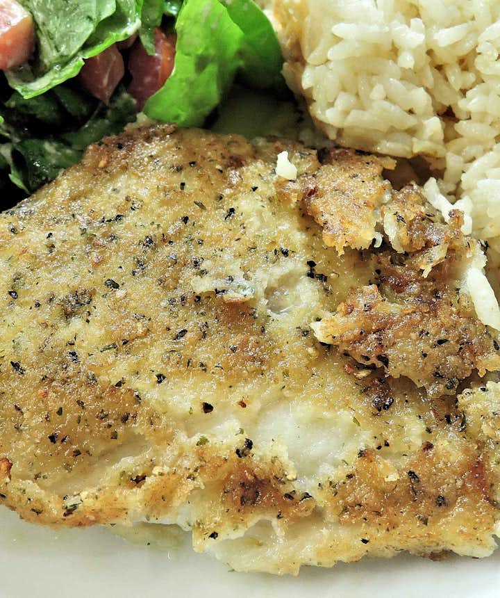 Baked fish served with rice.