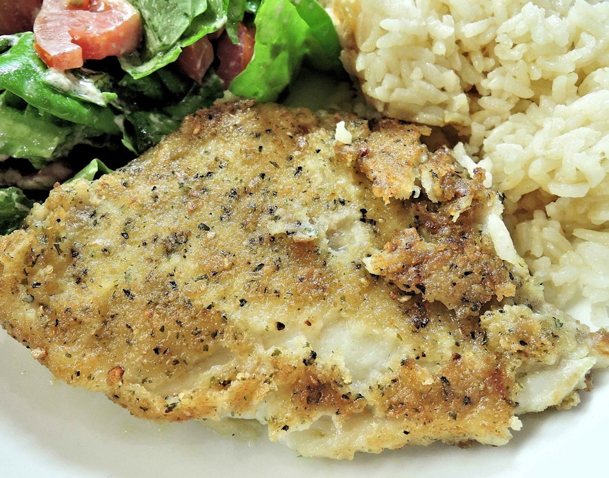 Baked fish served with rice.