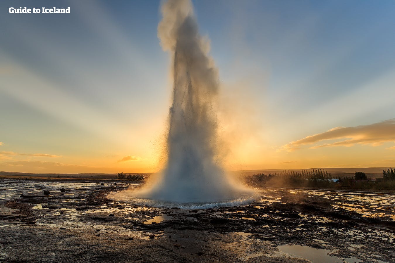 The iconic geyser Strokkur on the Golden Circle route, erupting in the twilight