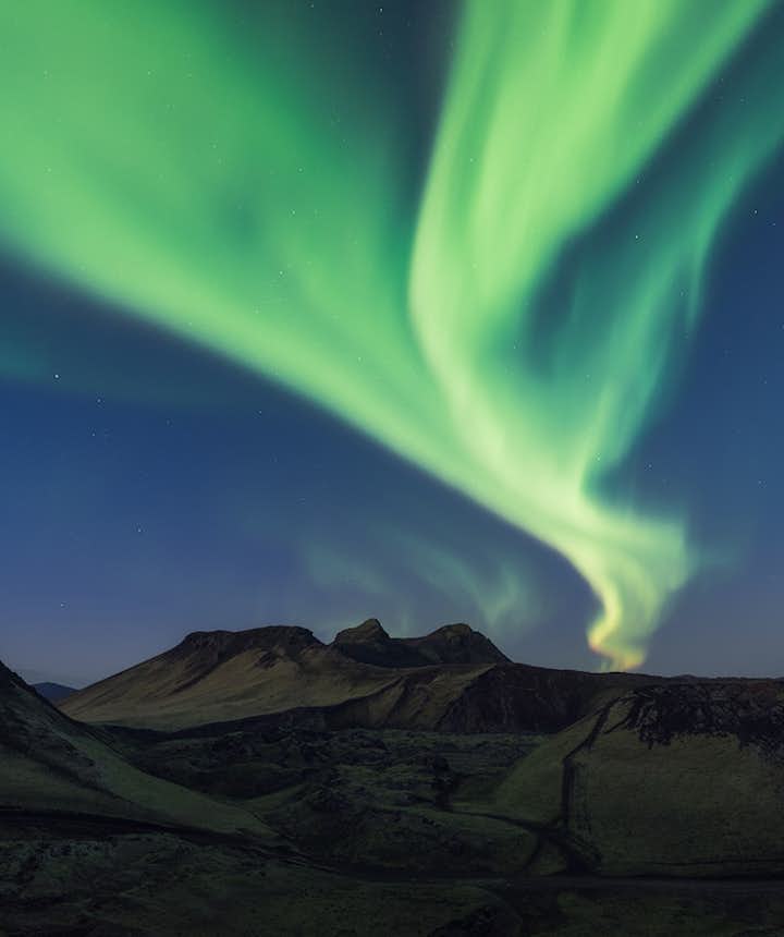 The Northern Lights most commonly appear as luminescent green ribbon.
