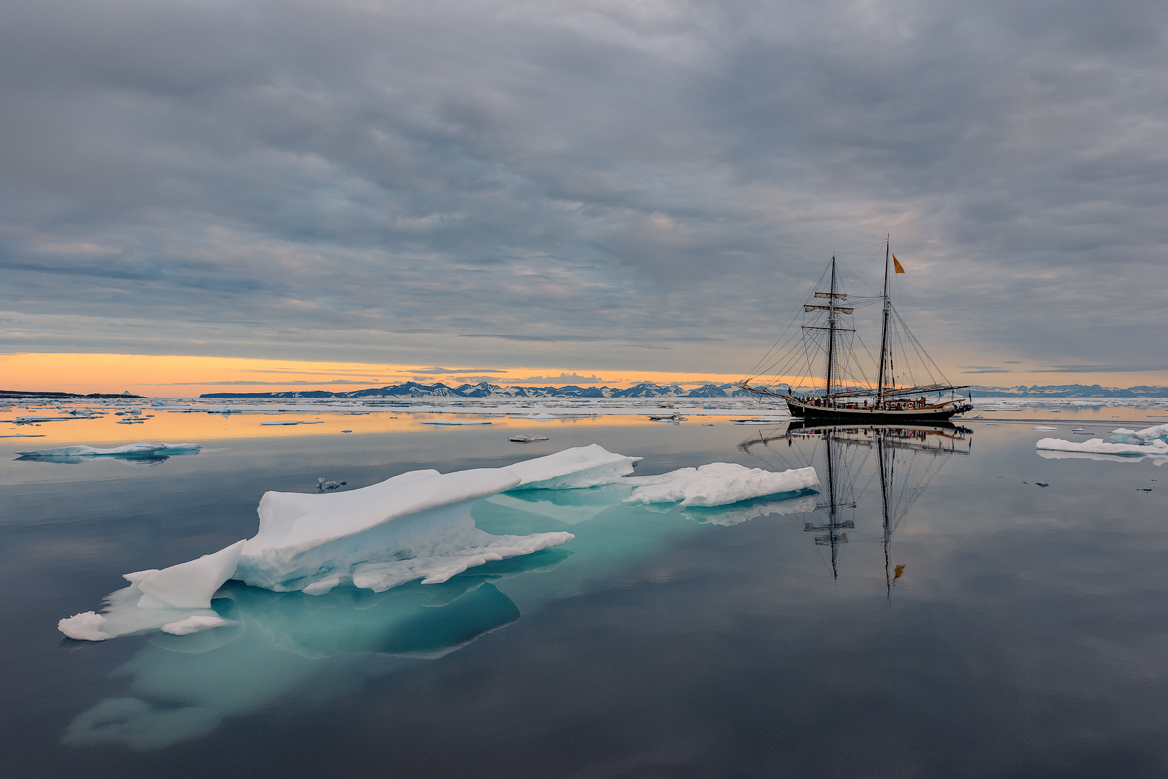 The Donna Wood vessel silently trailing past icebergs off the coast of Greenland.
