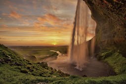 Seljalandsfoss on the South Coast of Iceland bathed in the otherworldly light of the midnight sun.