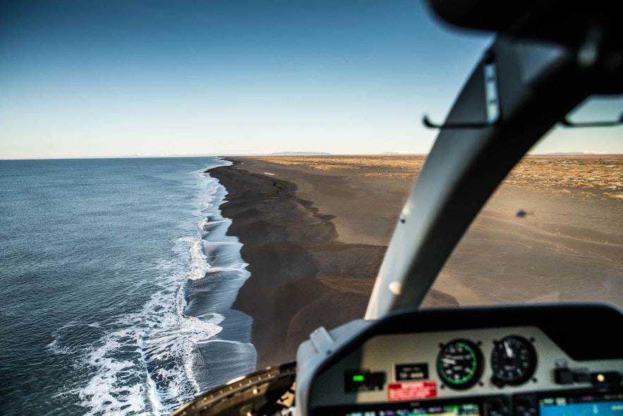 The South Coast, as seen from the cockpit of a helicopter.