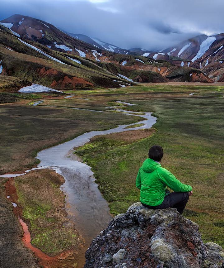 A solo traveller appreciating the incredible scenery of Iceland's Central Highlands.