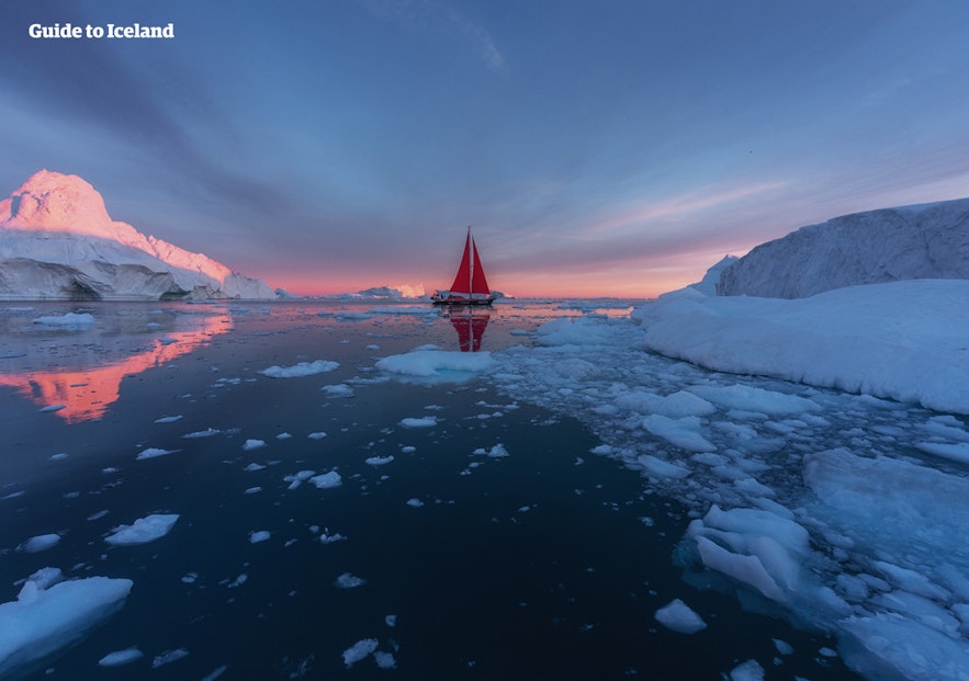 A yacht floats idly off Greenland's coasts.