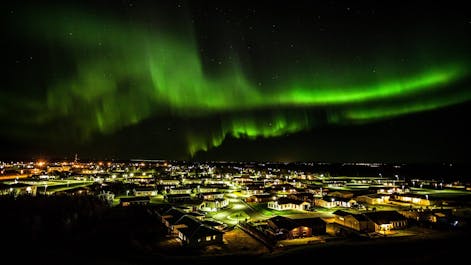 Northern Lights dancing above Hvolsvöllur in South Iceland.