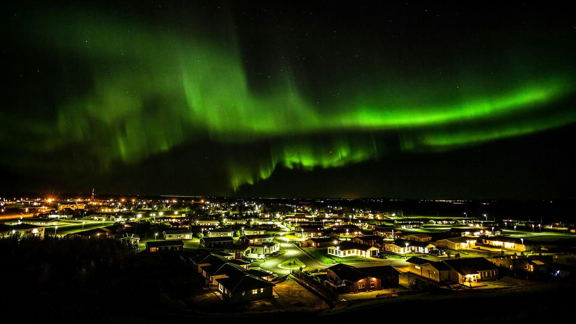 Northern Lights dancing above Hvolsvöllur in South Iceland.