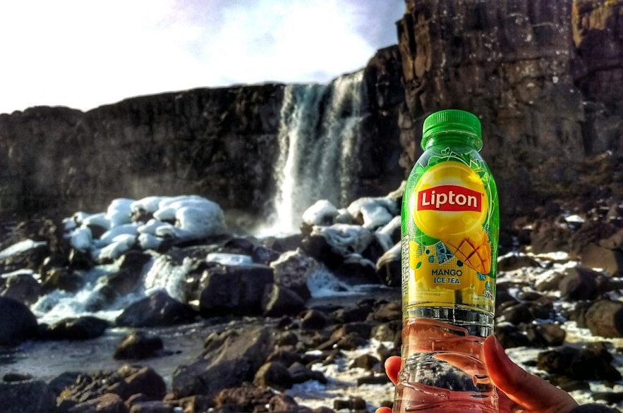 Drinking water from Oxararfoss waterfall in Iceland