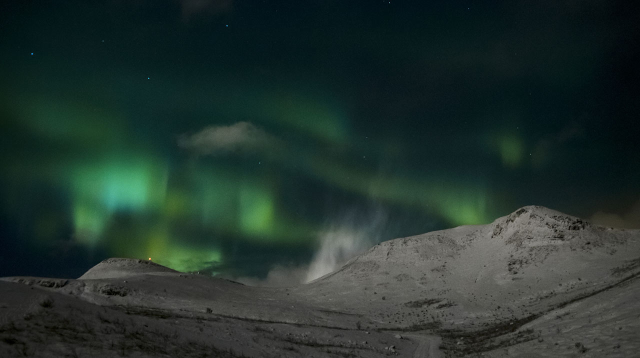The reaches of Iceland's winter nature by night are often crowned by the northern lights.