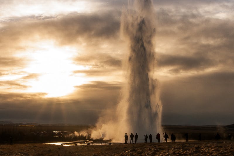 The mighty geyser Strokkur erupting high into the air.