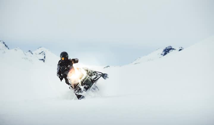 A person maneuvering their snowmobile at Langjokull glacier.