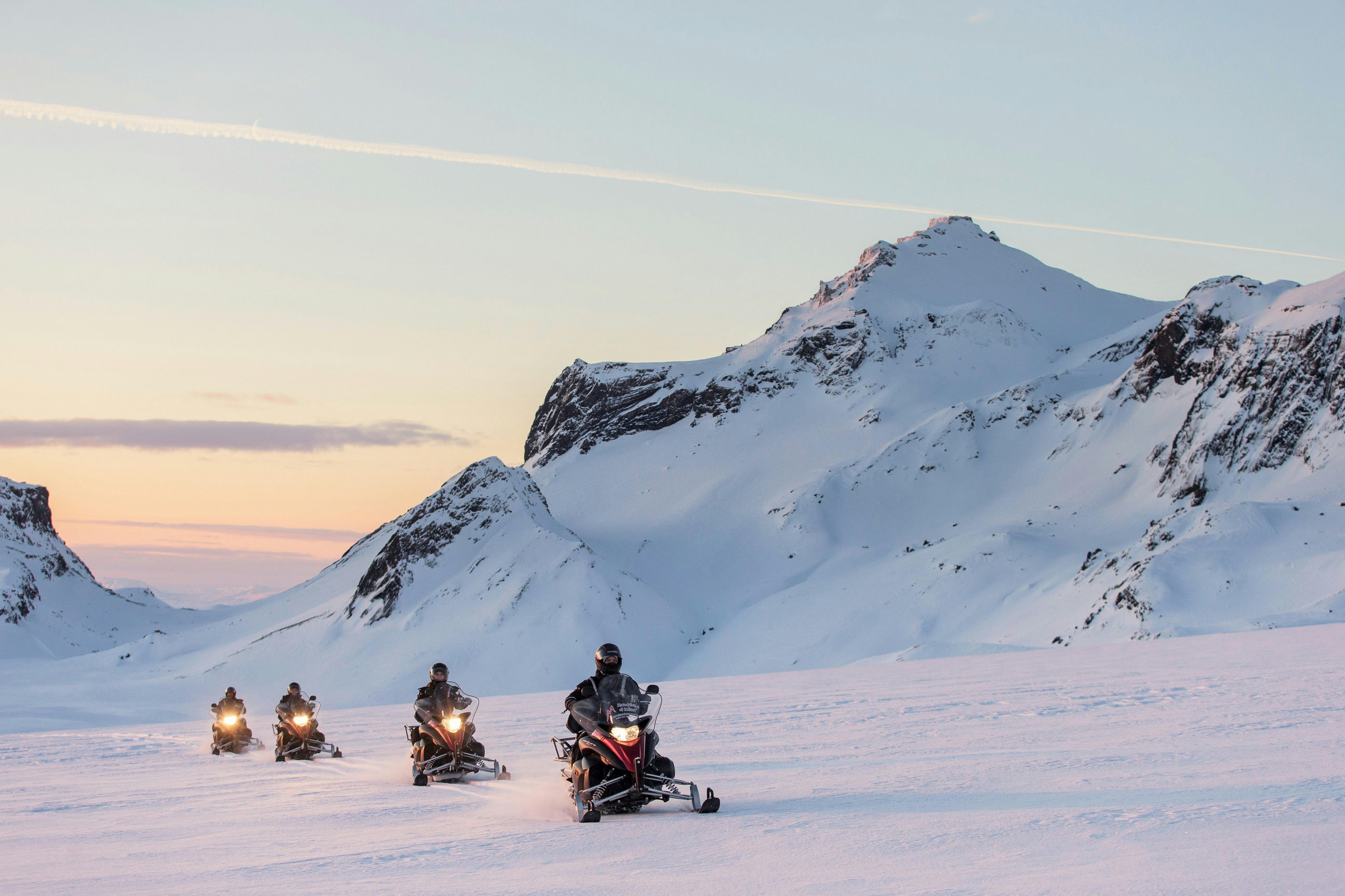 Race across Langjökull glacier on a snowmobile and feel the adrenaline surging in your veins.