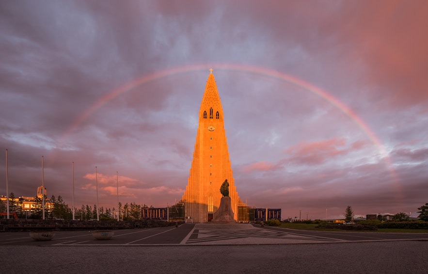 Iceland's largest church beneath a rainbow.