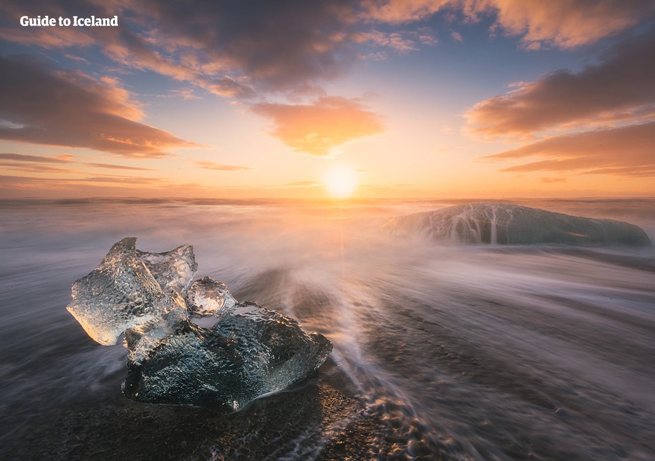 Ice melting as the sun sets on the Diamond Beach in Vatnajökull National Park.